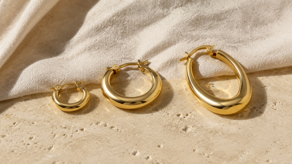Gold-tone hoop earrings in huggie, rounded and sculptural wholesale styles