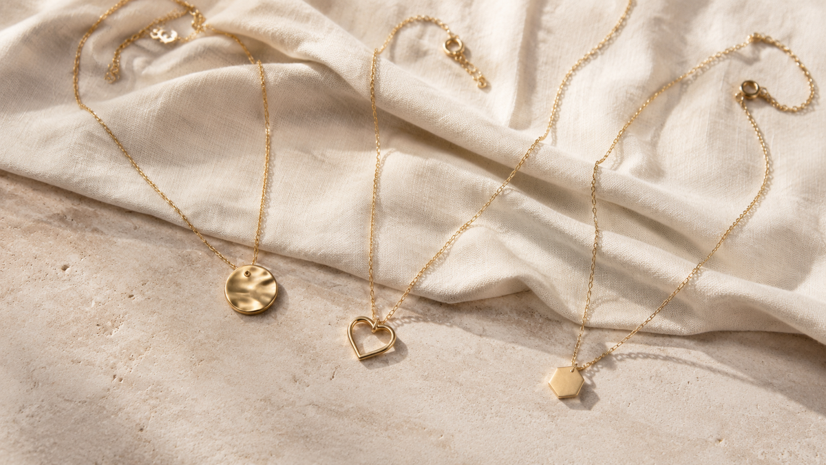 Gold-tone pendant necklaces with organic, heart and geometric charms