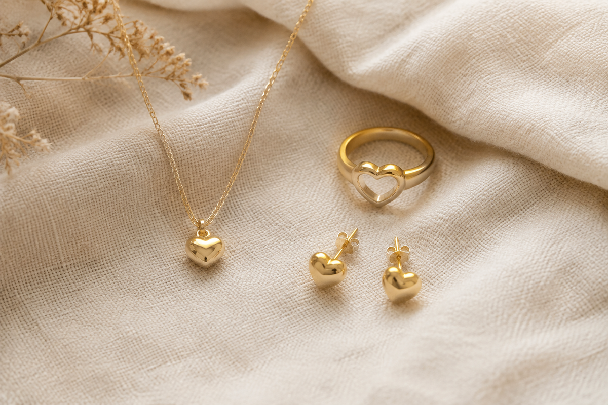 Heart-shaped gold jewelry styles photographed for a wholesale fashion collection