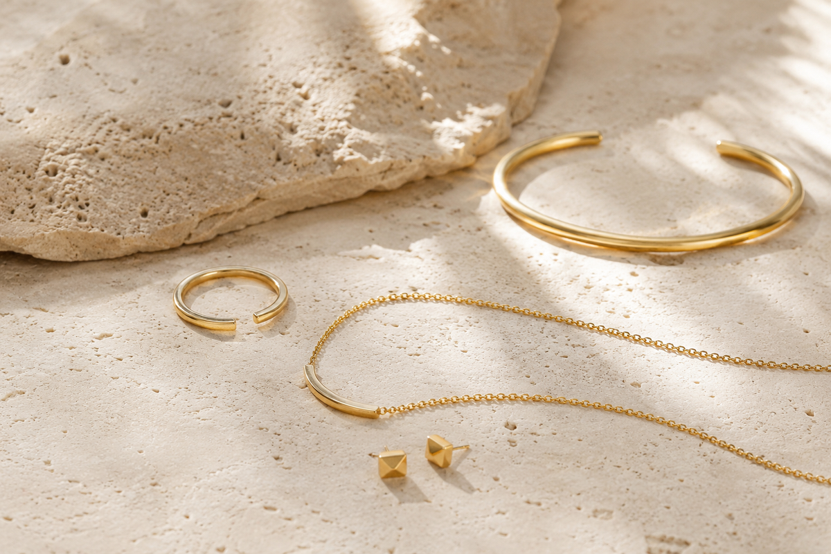 Minimalist gold jewelry styles photographed for modern boutique buying