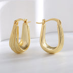 Gold-Plated Brass Twisted Geometric Ear Cuff Earrings in a gold-tone brass finish