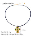 Gold-Plated Stainless Steel Cross Cubic Zirconia Pendant Necklace with Stone Detail — product styling — jewelry finish and design detail