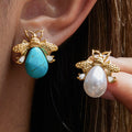 Gold-Plated Turquoise Pearl Stainless Steel Stud Earrings — Contemporary Style — front view — jewelry finish and design detail