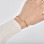 Gold-Plated Brass Cuban Link CZ Chain Bracelet with Linked Detail in a gold-tone brass finish