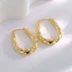 Gold-Plated Brass Twisted Spiral Ear Cuff Earrings in a gold-tone brass finish