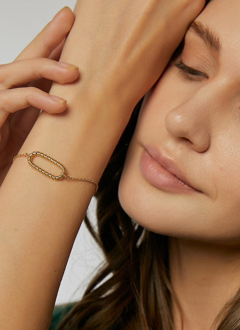 B0090   Simple Gold-Plated Braided Oval Bracelet for Women Woven Circle Hollow Egg-Shaped Bangle