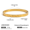 Gold-Plated Stainless Steel Bangle Bracelet with Cubic Zirconia Detail — front detail — jewelry finish and design detail