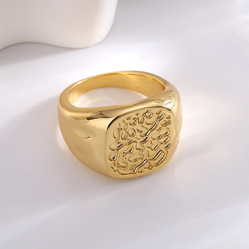 Gold-Plated Brass Asymmetric Ring with Minimalist Detail in a gold-tone brass finish
