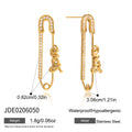 Gold-Plated Stainless Steel Hoop Earrings with Teardrop Enamel Detail — product styling — jewelry finish and design detail