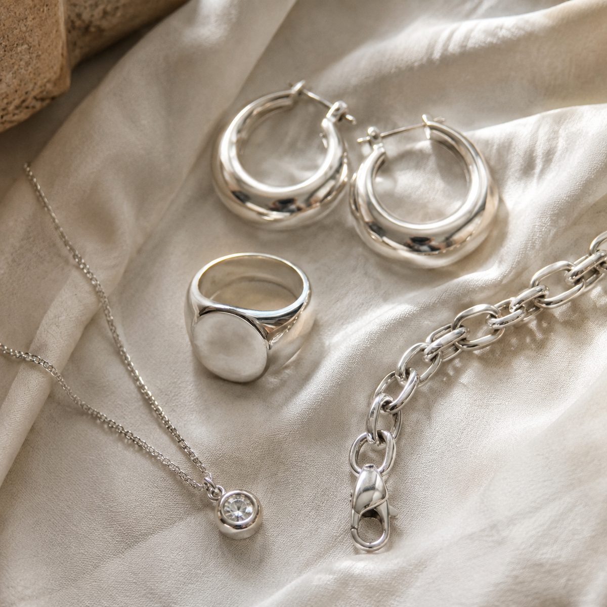 Custom 925 sterling silver hoop earrings, signet ring, chain bracelet and stone-set pendant