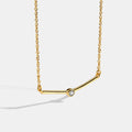Gold-Plated Brass Geometric CZ Necklace with Cubic zirconia Detail in a gold-tone brass finish