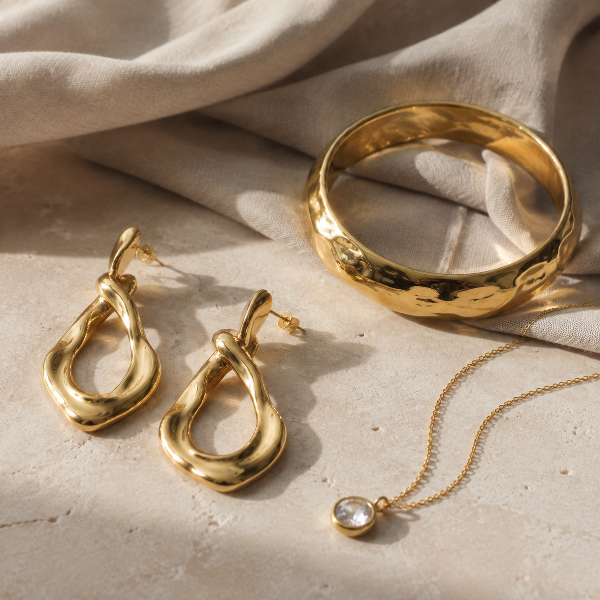 Gold-plated brass fashion earrings, bracelet and pendant for wholesale buyers