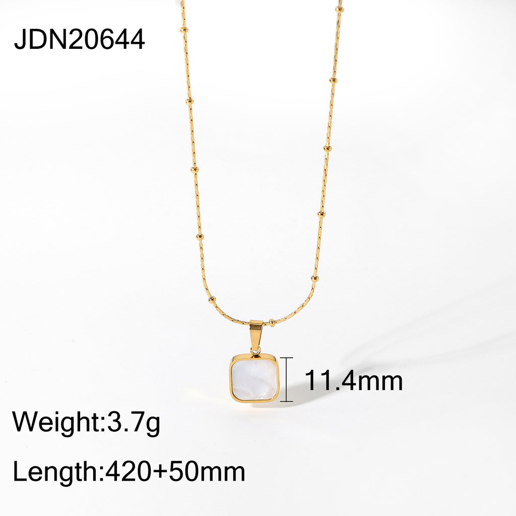 Gold-Plated Brass Shell Necklace styled for independent jewelry boutiques