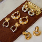 Gold-Tone Cubic Zirconia Stainless Steel Stud Earrings in a gold-tone stainless steel finish