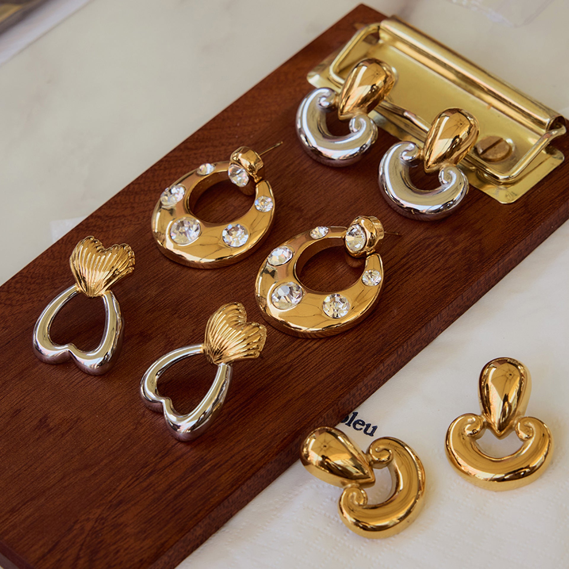 Gold-Tone Cubic Zirconia Stainless Steel Stud Earrings in a gold-tone stainless steel finish