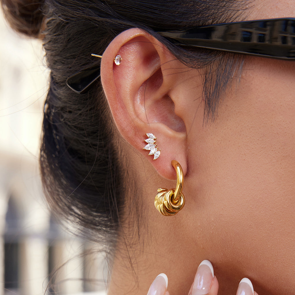 Stainless Steel Earrings in Gold-Tone — Polished Silhouette with polished design details