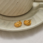 Gold-Tone Stainless Steel Pearl Hoop Earrings in a gold-tone stainless steel finish