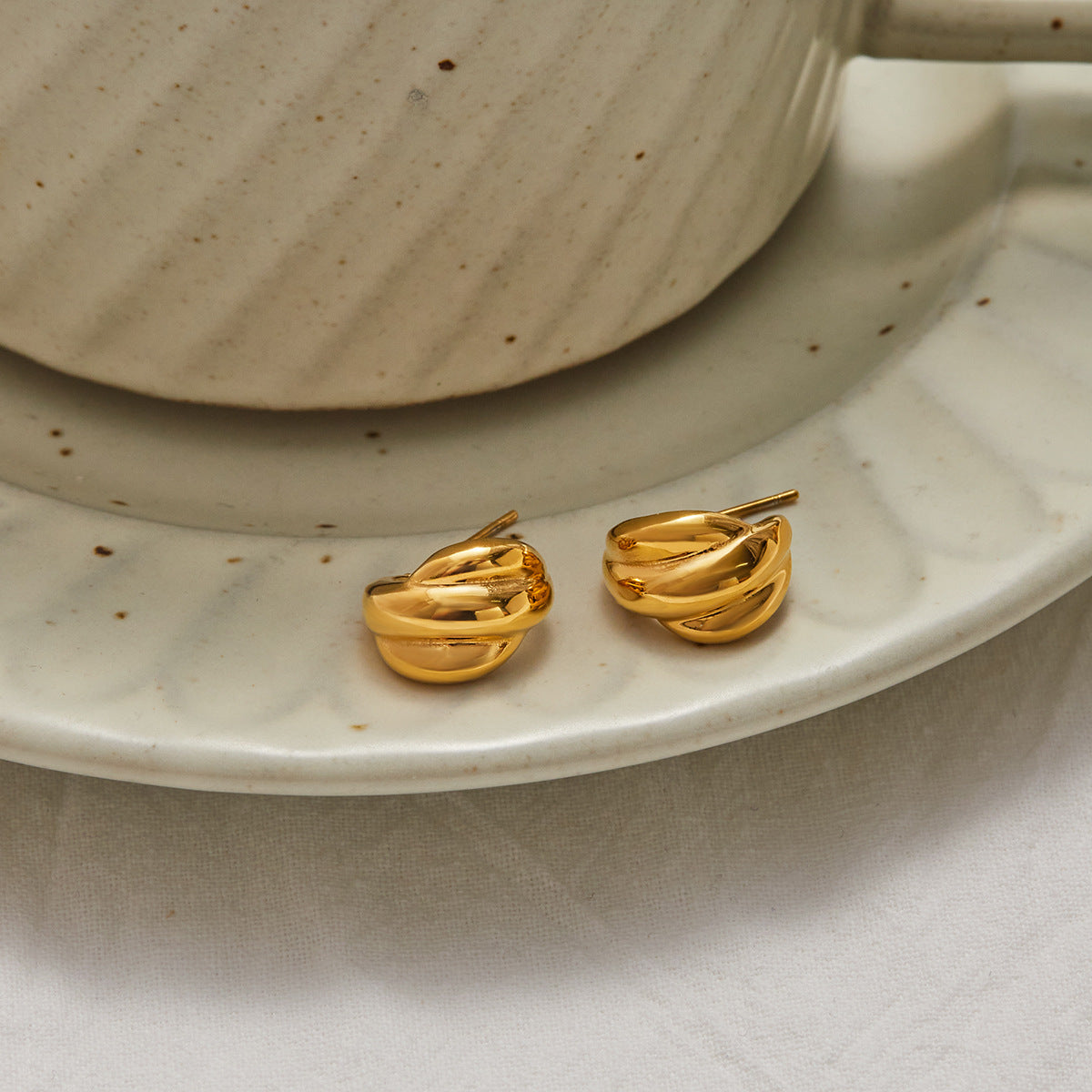 Gold-Tone Stainless Steel Pearl Hoop Earrings in a gold-tone stainless steel finish