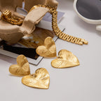 Heart Sculptural Gold-Tone Stainless Steel Earrings in a gold-tone stainless steel finish