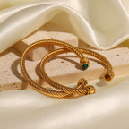 Gold-Tone Stainless Steel Cuff Bracelet with Stone Open Profile Detail in a gold-tone stainless steel finish
